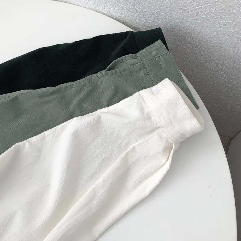 

Spring and autumn women's casual solid color lapel long-sleeved pocket decorated loose shirt