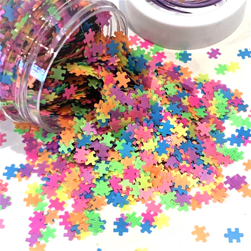 

Neon Puzzle- Shaped glitter multi color neon puzzle pieces, .50g weighed bags,4 mm Solvent Resistant Non-Toxic Polyester Glitter
