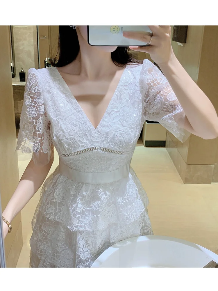 

Pure color sexy V-neck embroidery hollow flower waist waist dress ladies summer new style multi-level loose big hem Puff skirt