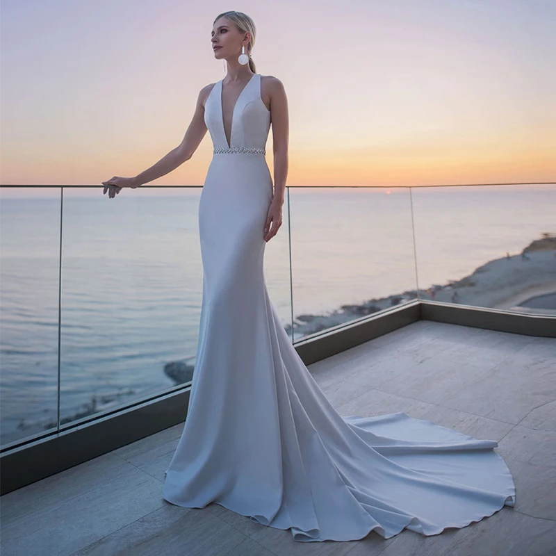 

New Modest Satin Mermaid Wedding Dresses 2021 Sleeveless Sexy Deep V-Neck Sweep Train Open Back Bridal Gown With Crystal Belt