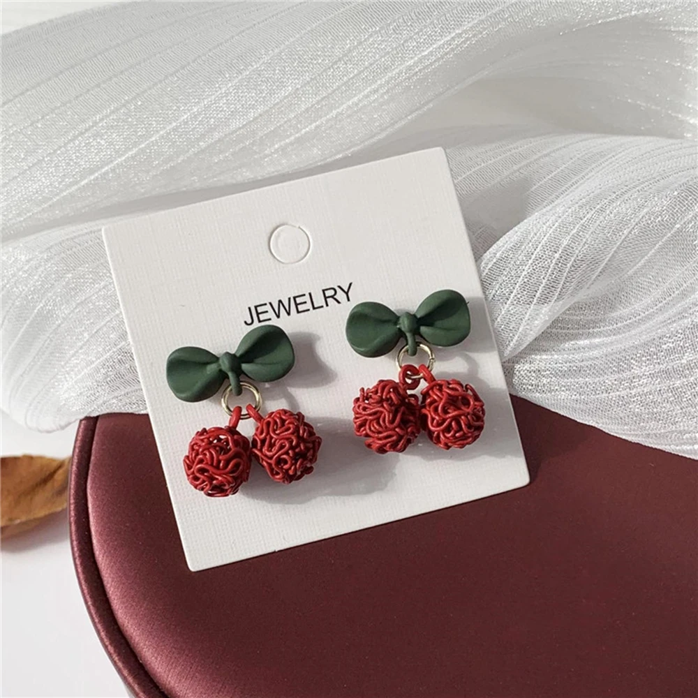 

Korean Temperament Cute Red Cherry Earrings Sweet Hollow Round Ball Bow Pendant Stud Ear Fashion Jewelry 2020 Gift