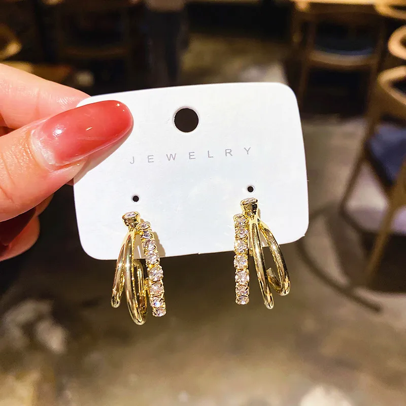 

Серьги-гвоздики женские трехслойные с простым покрытием и цирконом