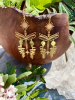 the gold plated raw peridot nature fairy earrings celestial witchy metaphysical jewelry