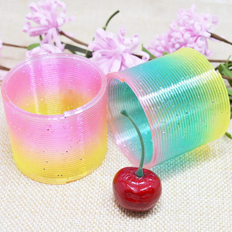 

10pcs Magic Plastic Smile Rainbow Spring Colorful Circle Coil for Children Games Funny Gift Elastic Ring Educational Toys