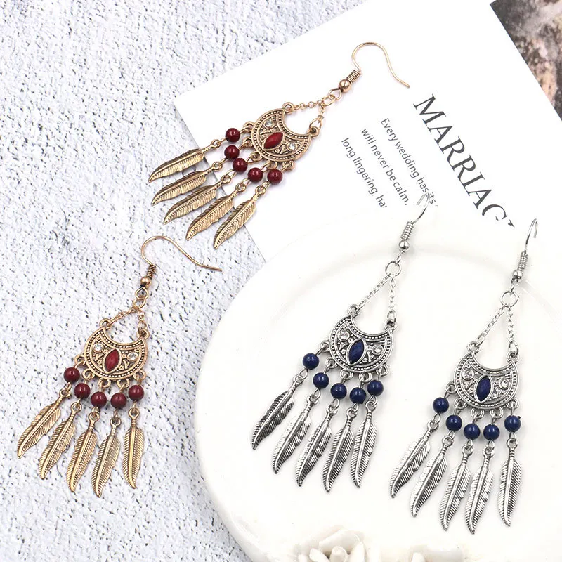 

2020 new crescent shaped leaf pendant tassel female earrings personality exaggerated alloy earrings