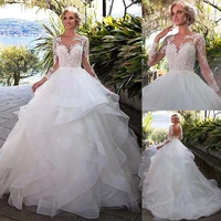 fantastic tulle gown round neckline ball gown wedding dress with beaded lace applique ruffled organza long sleeved bridal gown