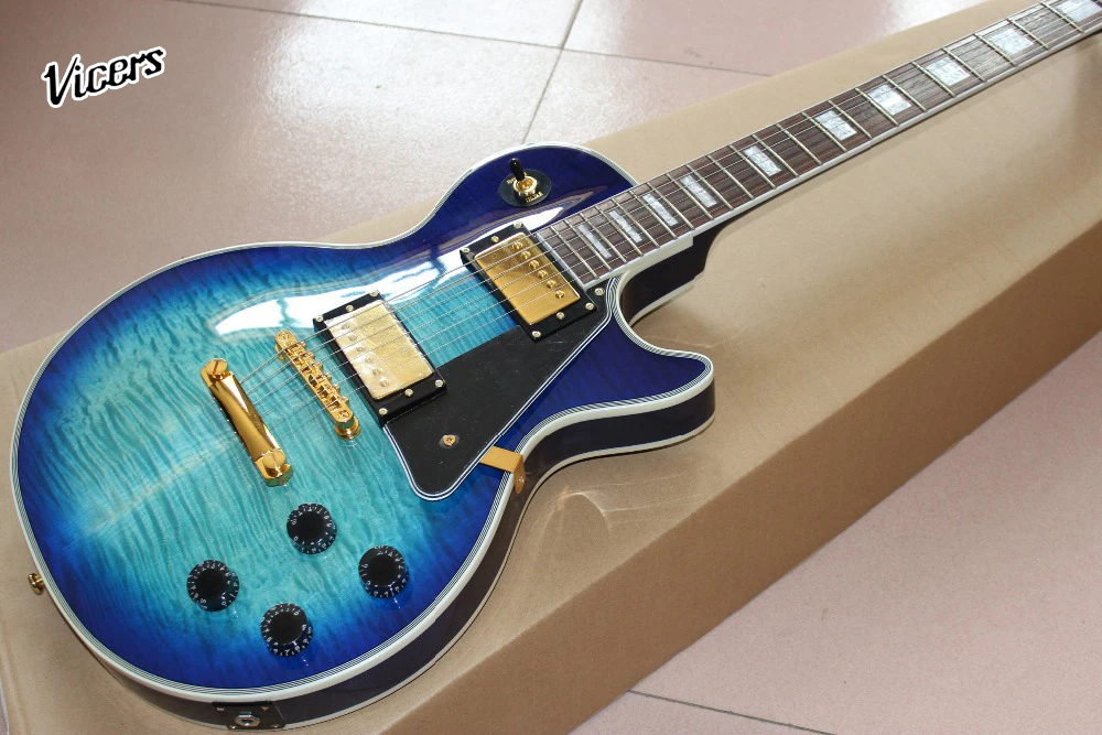 

Custom shop Electric Guitar.Mahogany body guitarra. blue color tiger flame gitaar.Gold color hardware