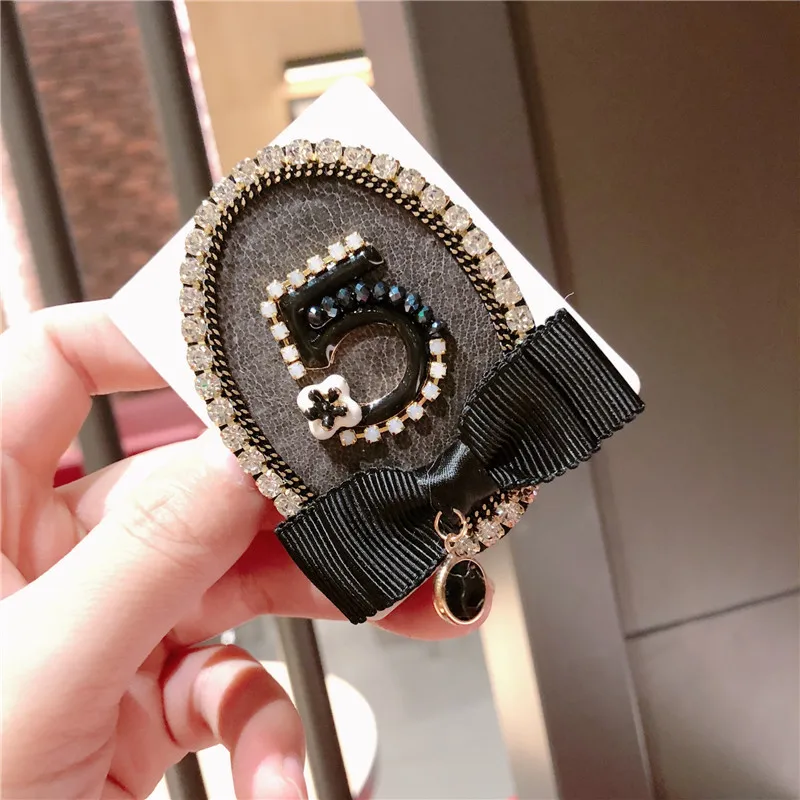 Фото Rhinestone Camellia Letter 5 Brooch Enamel Pin Women Round Ribbon Bow Brooches Fashion Badge Jewelry broche Z153 Украшения и Rhinestone Camellia Letter 5 Brooch Enamel Pin Women Round Ribbon Bow Brooches Fashion Badge Jewelry broche Z153 Украшения и