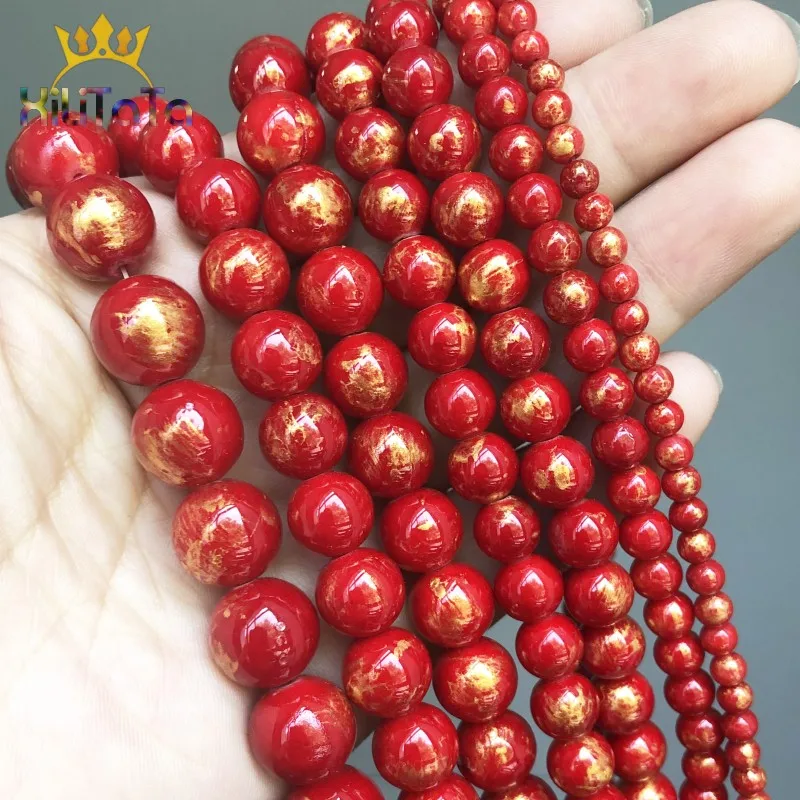 Круглые бусины из натурального камня красного цвета с золотым покрытием