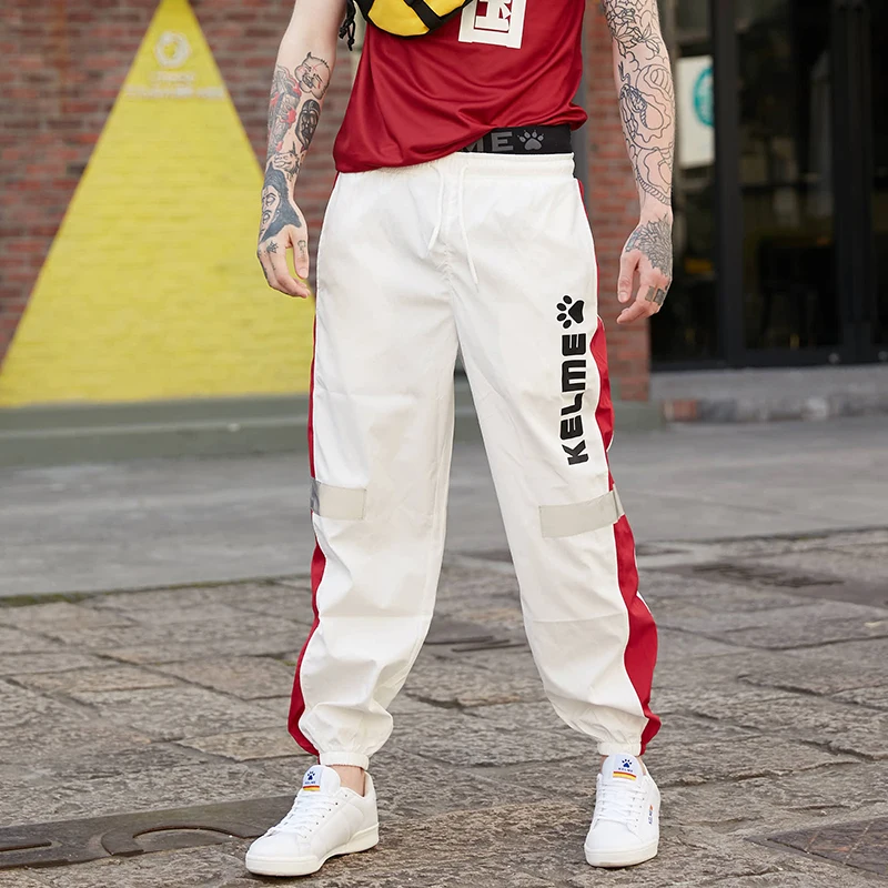 KELME Японская уличная одежда мужские брюки с полосками сбоку светоотражающие