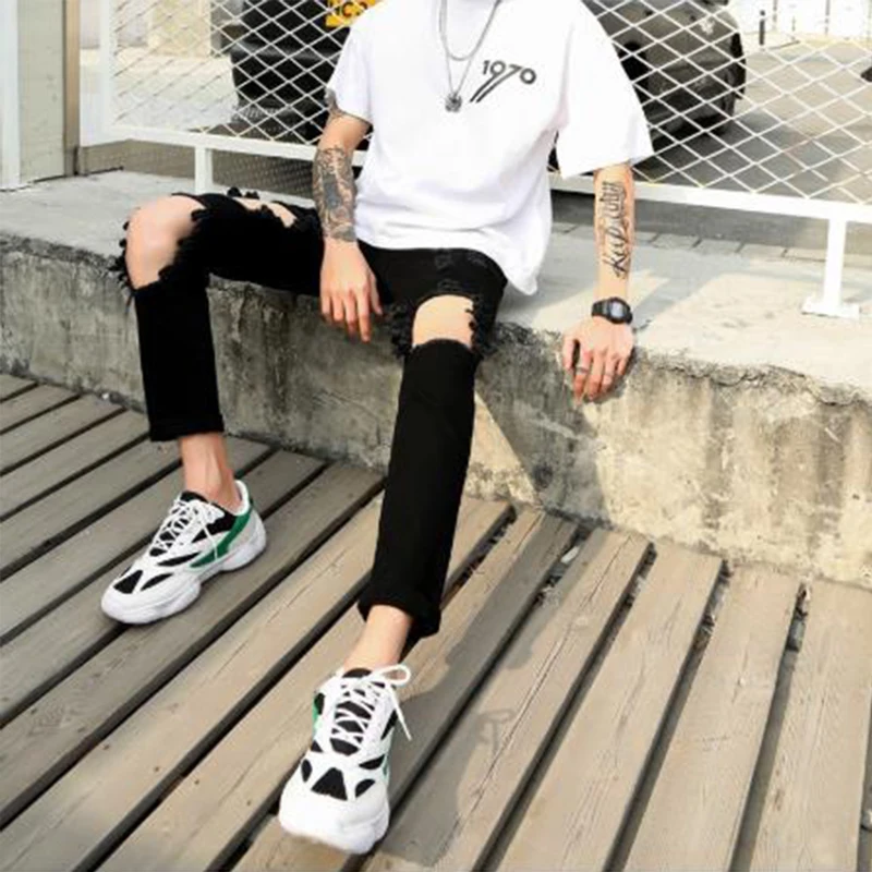Men's jeans Spring/summer European-American beggar pants ripped pants men's slim skintight slacks hip-hop punk black hole pants