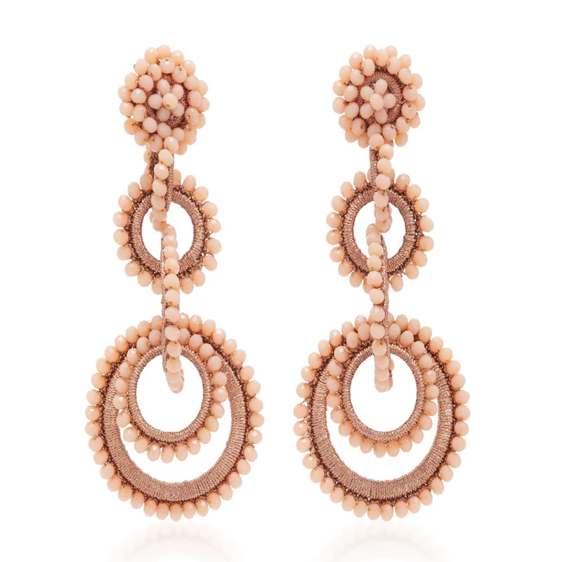 Большие серьги-подвески с перекрывающимися кольцами и кристаллами массивные