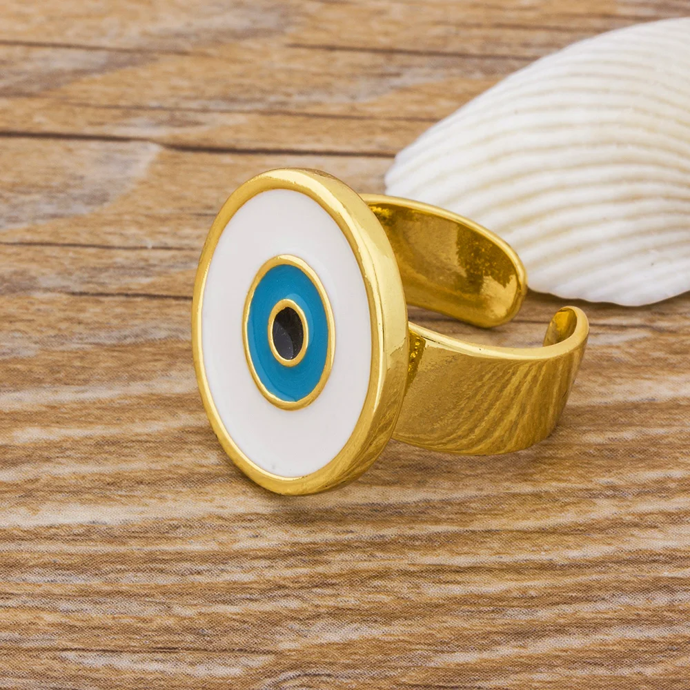 Кольца женские медные золотистые регулируемые с большим синим и белым глазом |
