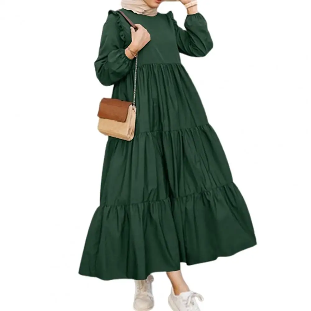 

Платье-макси свободного кроя с широким подолом, круглым вырезом и длинным рукавом