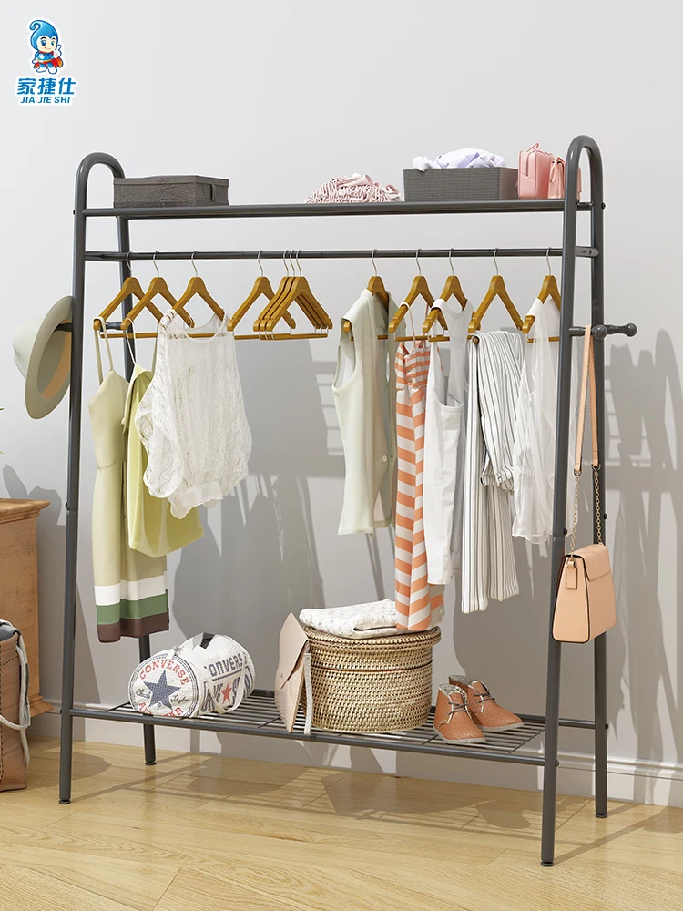 A movable rack for drying clothes in a family bedroom. |