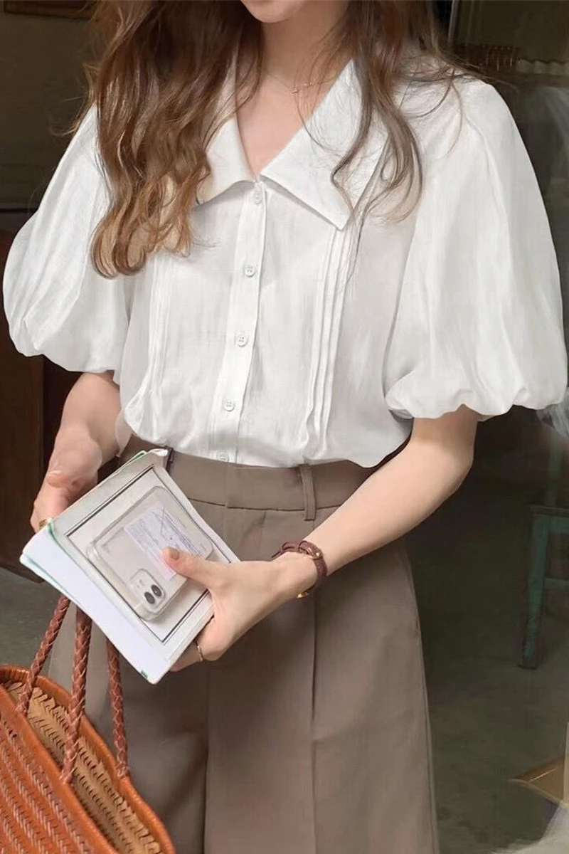 

White shirt women's new summer design niche French top unique Lapel temperament bubble sleeve short sleeve shirt