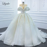 liyuke puff sleeve exquisite ball gown wedding dresses with corset back court train gorgeous skirt