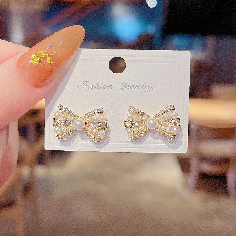 

Korean Style Simulated Pearl Zircon Bow Stud Earrings for Women Fashion 925 Silver Needle Gold Color Earrings Party Jewelry Gift