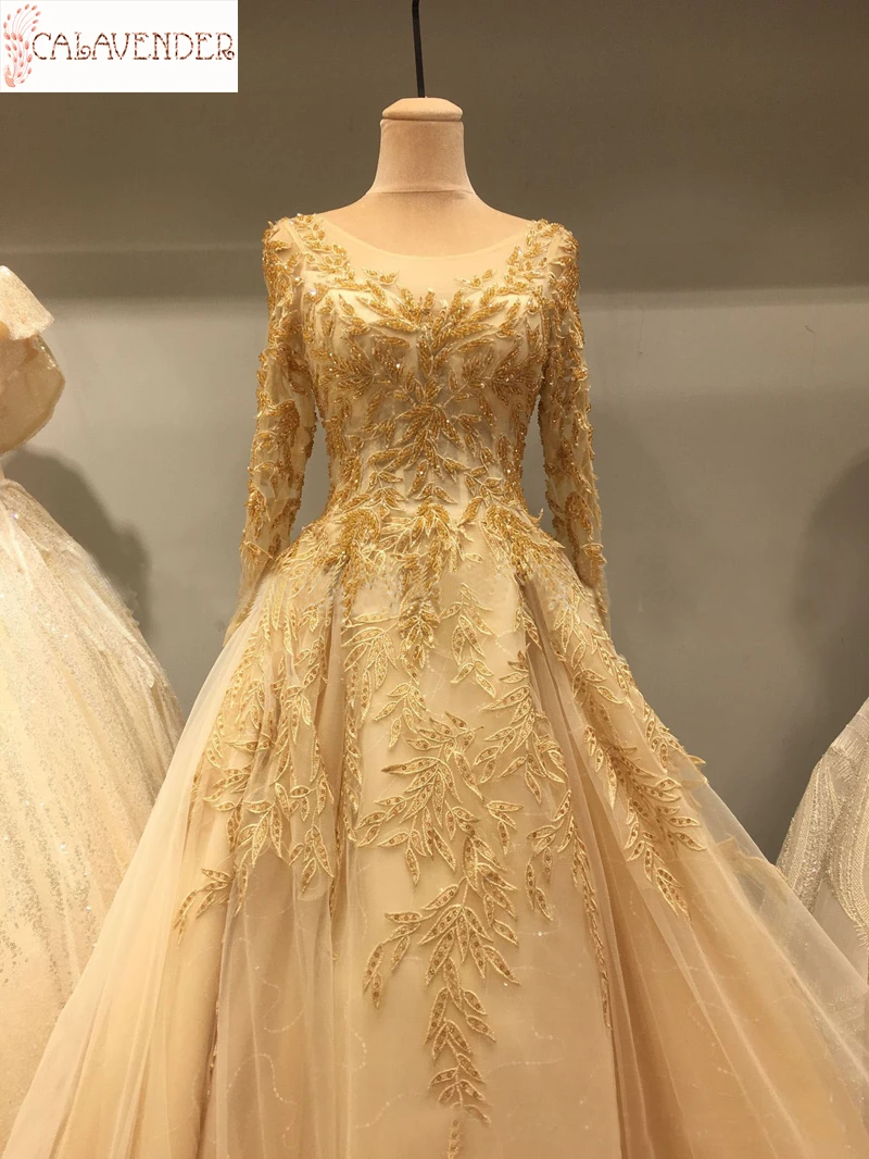 Lace Gold Wedding Dresses Ball Gown Appliques Crystals Beaded Wedding Gown with Chapel Train Long Sleeve Bridal Dresses vestidos