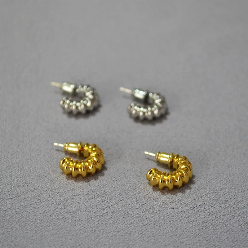 

Korean brass gold-plated irregular concave-convex pattern texture temperament C small earrings earrings women spiral earrings