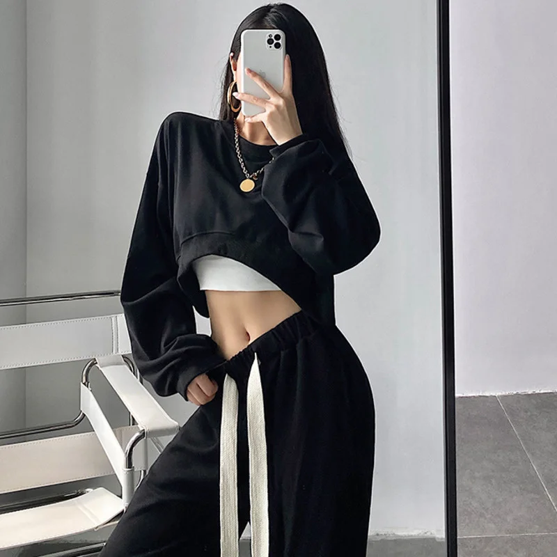 

Женский пуловер с круглым вырезом и изогнутым подолом