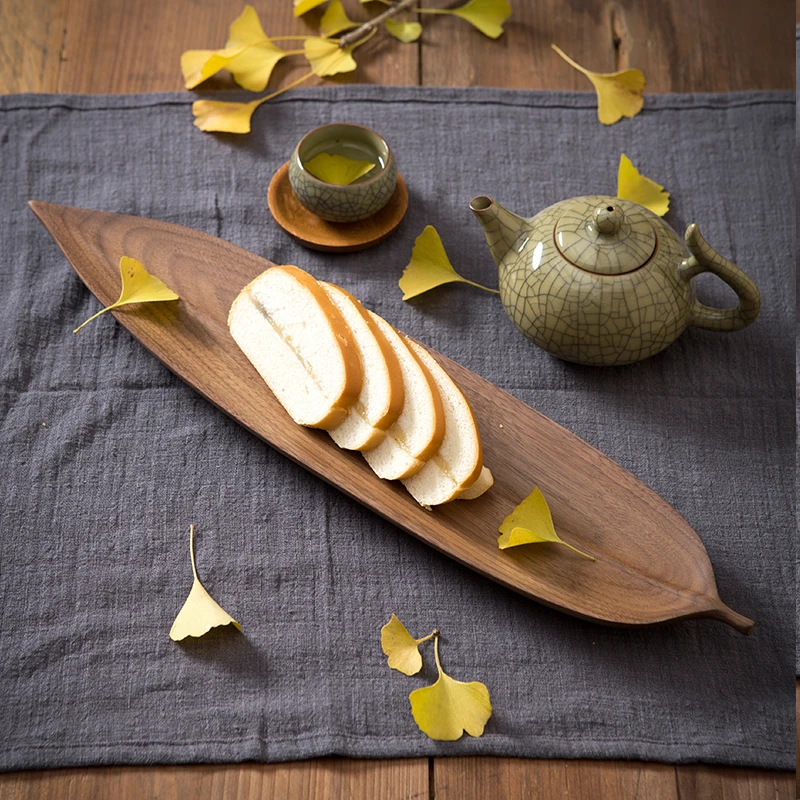 

Black walnut wooden tray leaves wooden tray dry fruit dessert Western food plate solid wood plate fruit plate sushi plate