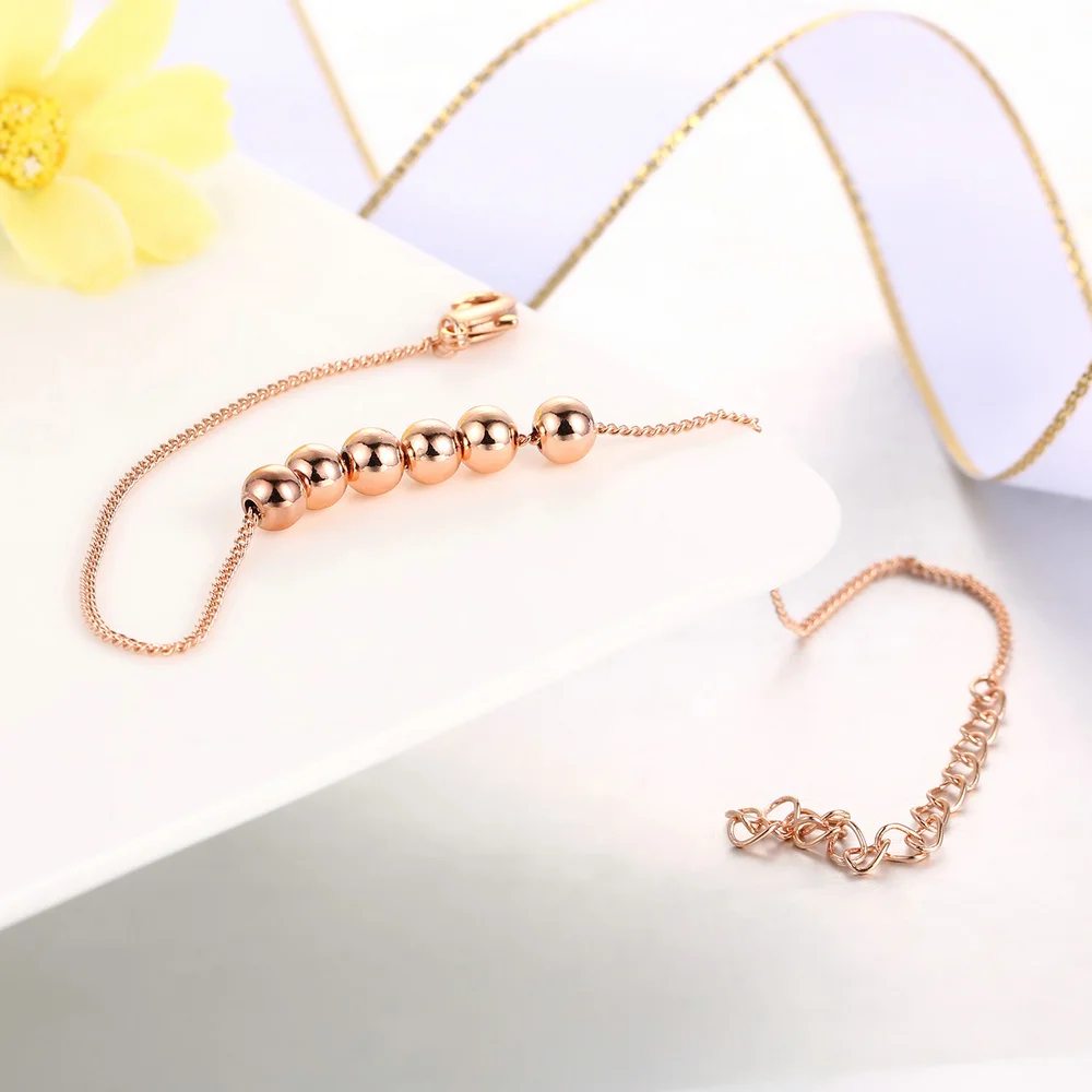 Женский браслет с маленькими шариками цепочкой из звеньев под розовое золото