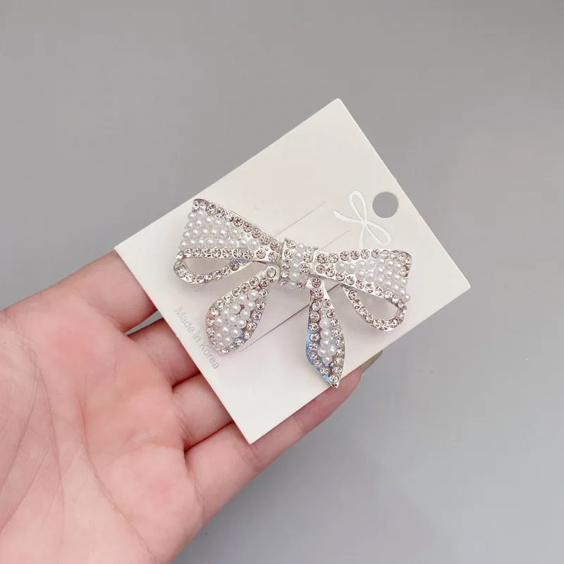 

CN Elegant Crystal Barrettes for Women Pearls Paved Hair Clips Metal Pinch Cock Bowknot Headdress Accessories Jewelry Gift 2021