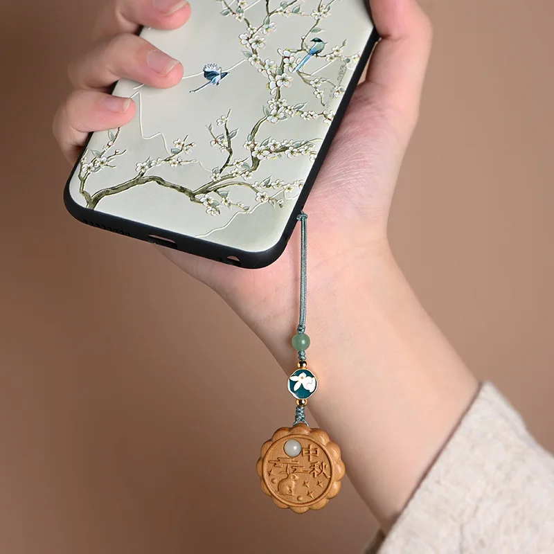 

Chinese elements green sandalwood carved moon cake mobile phone pendant mobile phone chain Mid-Autumn Festival gift pendant