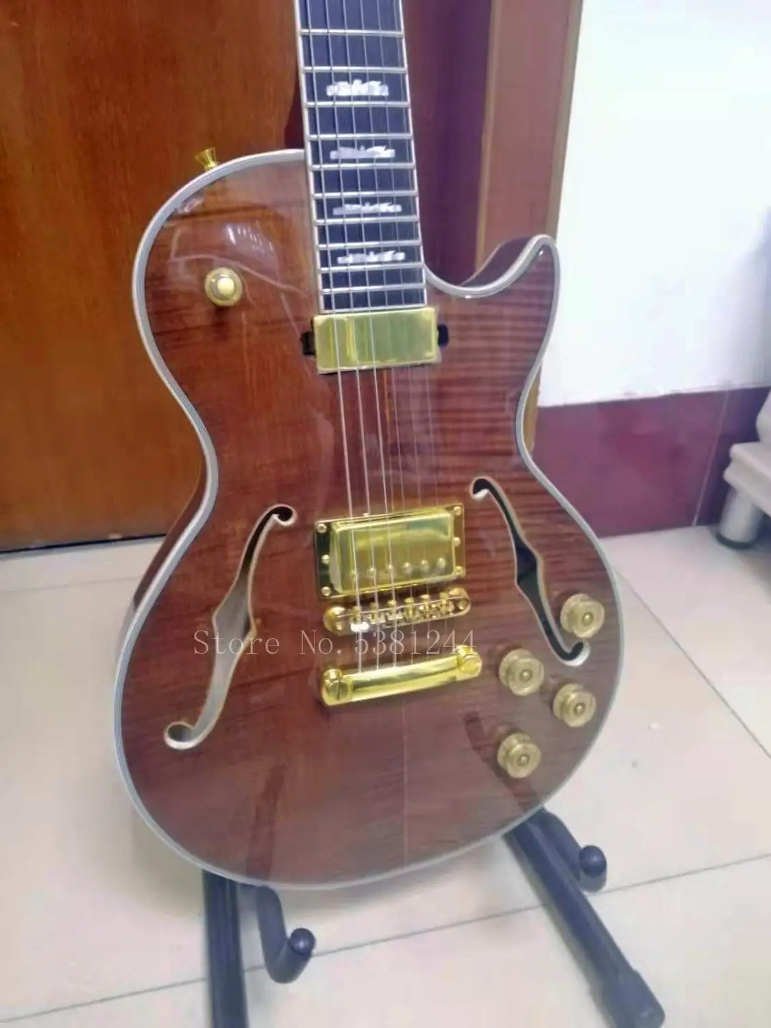 Transporte gratuito guitarra eléctrica personalizada de FABRICA diapason ébano agujero doble f rayas tigre dobles | Спорт и
