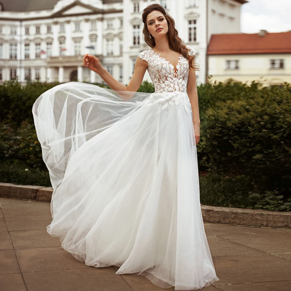 

Illusion V Neck Sleeveless Wedding Dresses A Line Cap Sleeve Appliques Floor Length Bohemian Boho Bride Dresses 2021