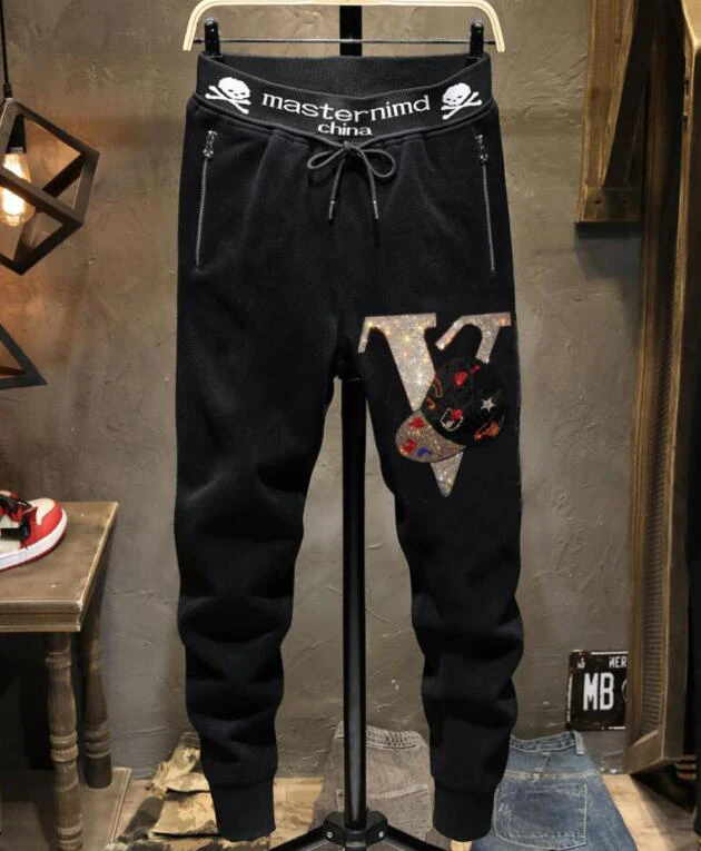 

New arrival Europe style new fashion brand men's casual hot drilling pants slim Leggings men's scalded skull head elastic pants