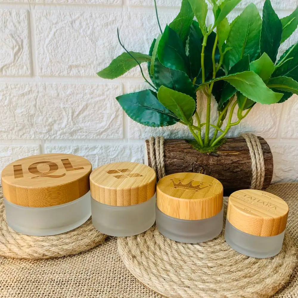 

Wholesale Custom Logo Skin Care Lotion Cream Jar With Bamboo Lid Clear Frosted Glass Cosmetic Container Packaging