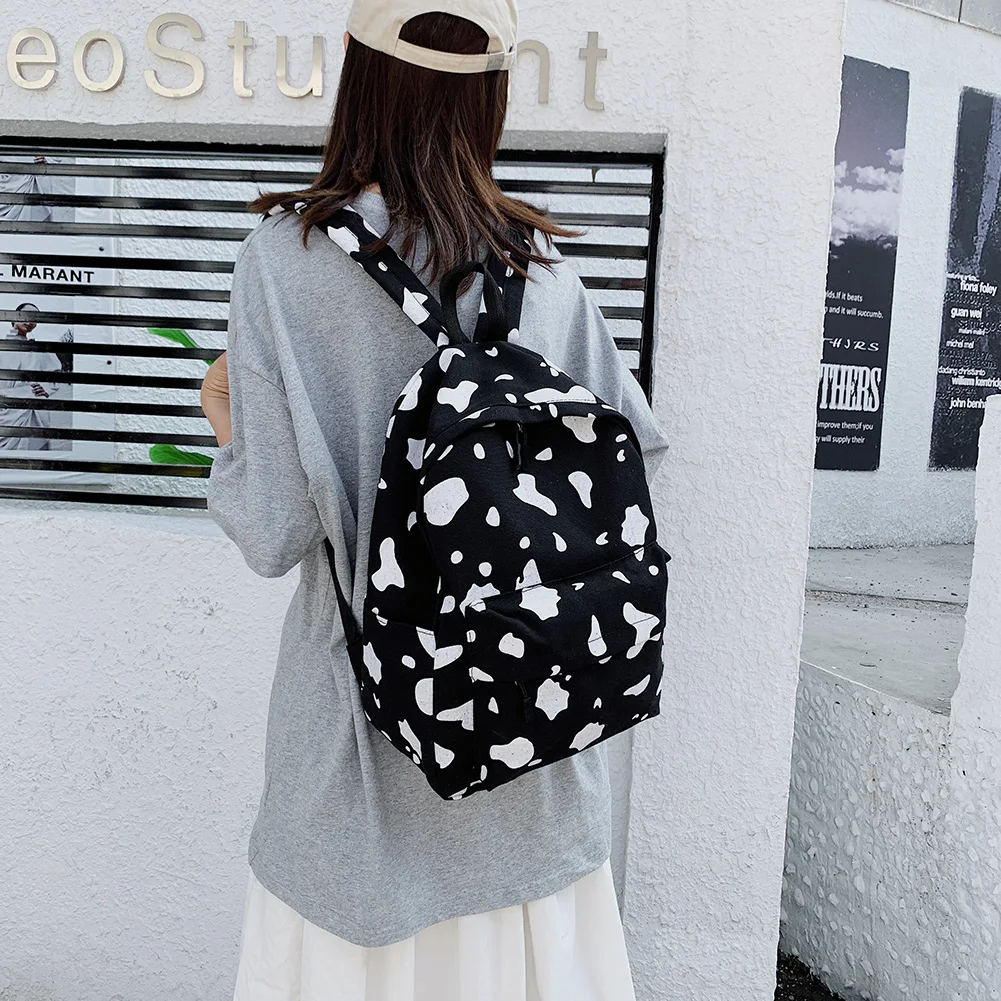 

Cow Milk Print Backpack for Women Canvas Large Capacity Students Girls Daily Shoulder School Bag Rucksack