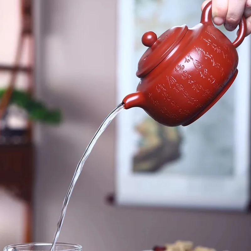 

Yixing handmade Dahongpao purple clay pot engraved with Chinese characters