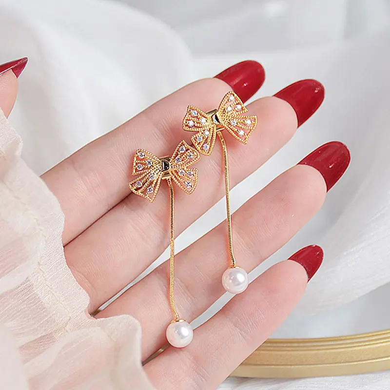 

Simple Classic Earrings Romantic Glamour Earring For Female Bowknot Hollow Out Long Earring Temperament Sale Elegant Earrings