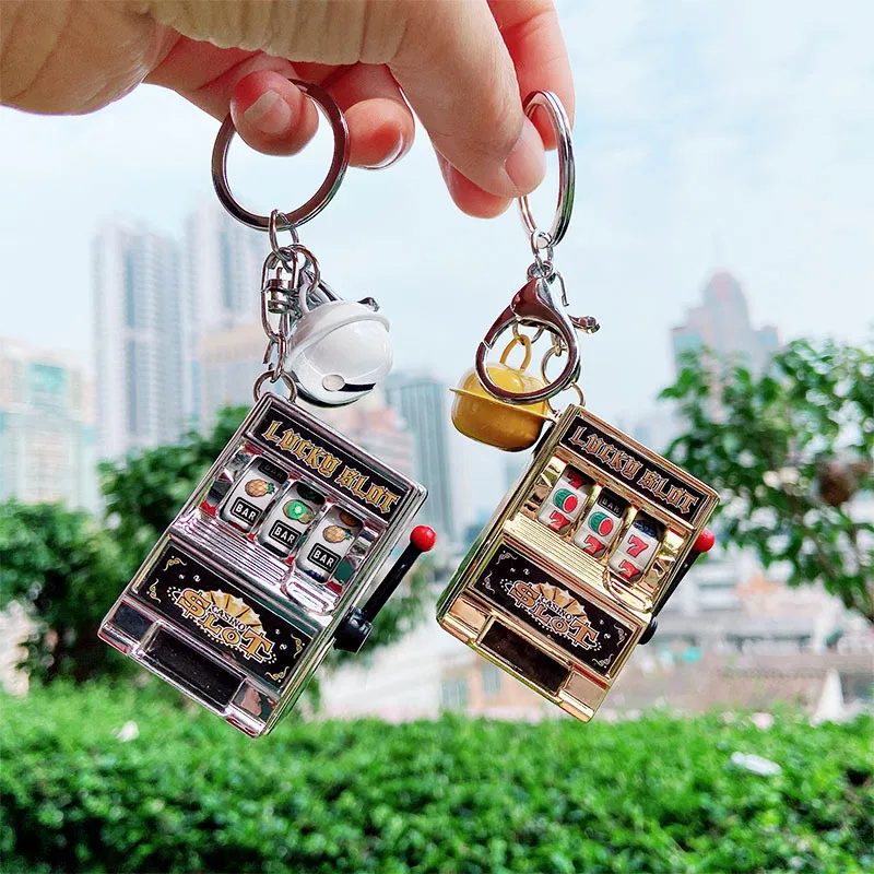 

Creative Mini Slot Machine Bell Car Keyring Pressure Relief Palm Pouch Fruit Keychain Puzzle Doll Keychains Small Bell Pendant