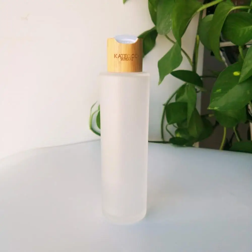 

glass bottle 100ml Frosted Glass Bottles with Bamboo Wood Lid Lotion Shampoo Pump Cap jars for cosmetics