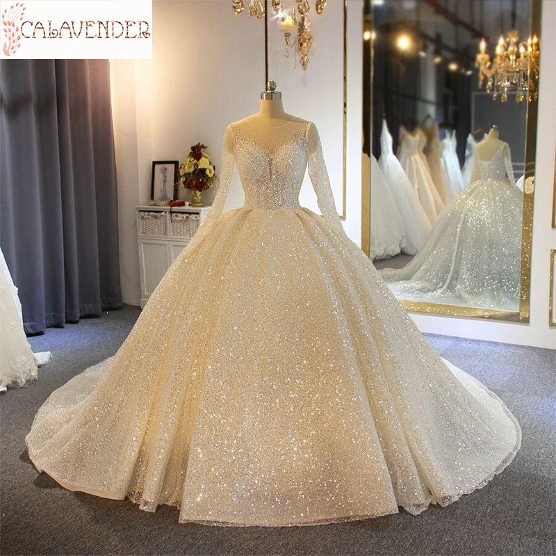 

2020 Sparkling Ball Gown Wedding Dresses Sheer Jewel Neck Appliqued Sequins Long Sleeves Lace Bridal Gowns Abiti Da Sposa