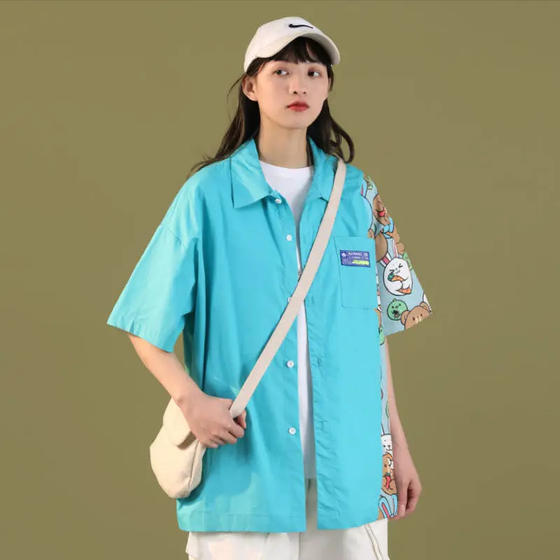 

Short sleeved splicing shirt female 2021 new fashion student Korean version loose design sense small top for summer wear outside