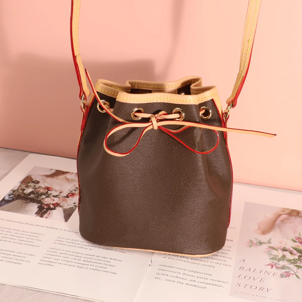 

Top Quality Classic Luxury Design Mini Bucket Bag Knot Tape 100%Genuine Leather Messenger Bag rope convergent Free Shipping