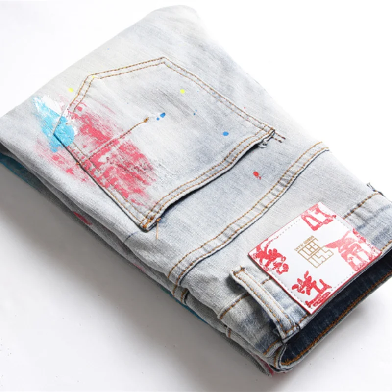 Korean Fashion Multicolour Graffiti Hip Hop Men Pencil Jeans Trousers Hole Ripped Slim Denim Pants For Nightclub Pantaloni Uomo