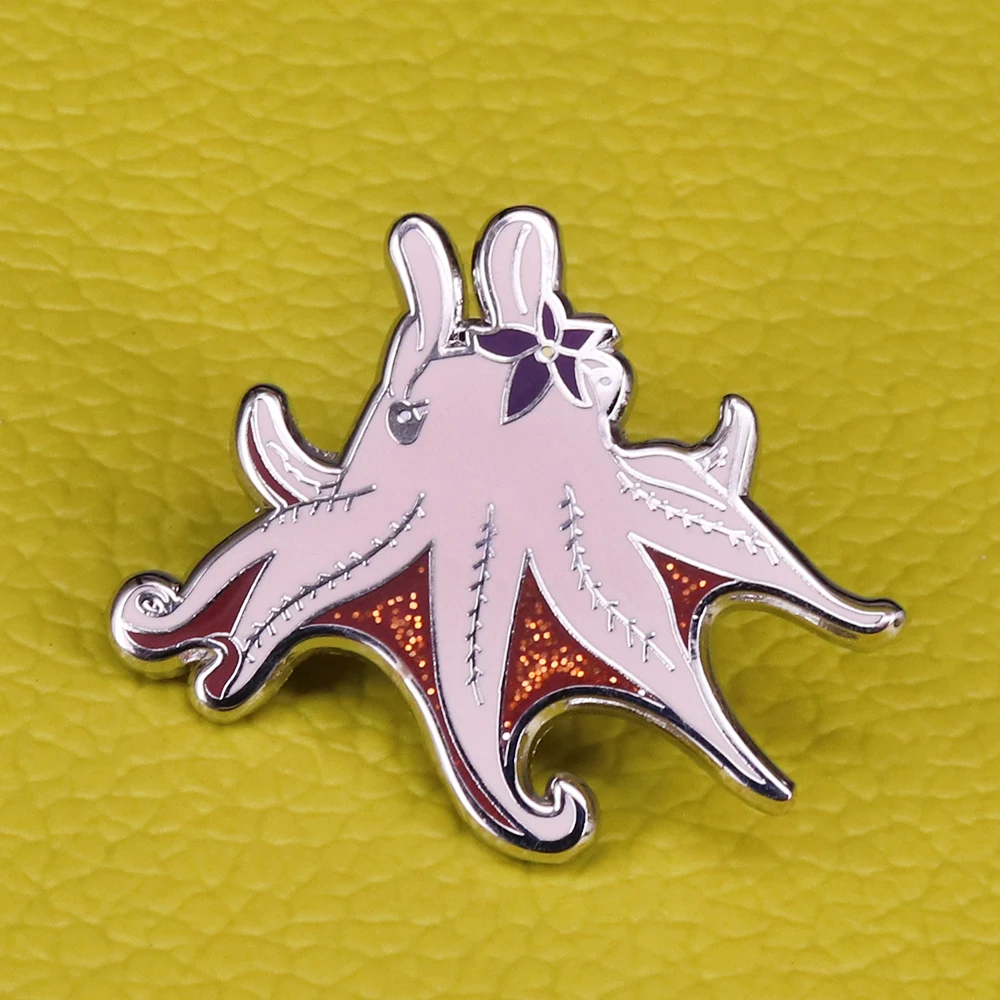 Cute little dumbo octopus pin Salty Sea Series badges feature glitter in between her tentacles and on the purple flower