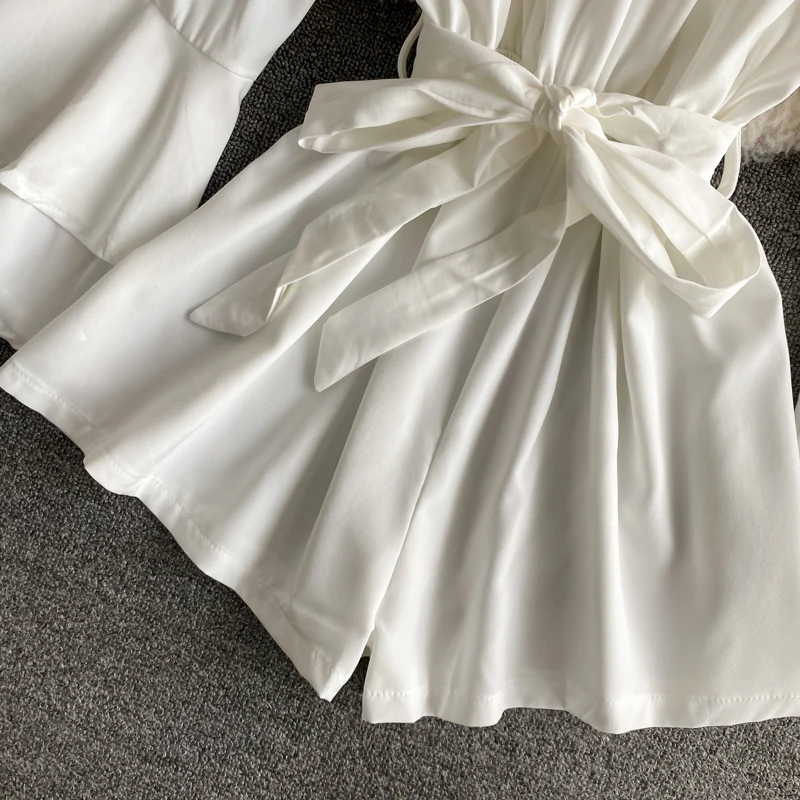 

KUSAHIKI Slash Neck Strapless Ruffle Women Playsuits Sahses Slim Waist Wide Leg Bodysuit 2021 New Flare Sleeve Romper 6F770