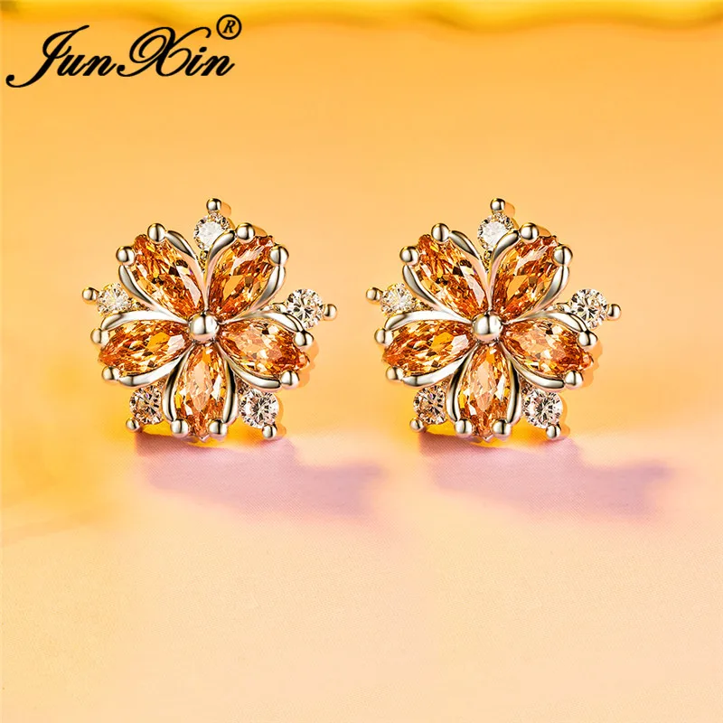 Серьги-гвоздики женские с кристаллами фиолетовые красные в форме снежинки из