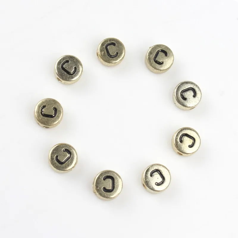 Акриловые бусины с английской надписью 4*7 мм круглые золотистые буквами алфавита