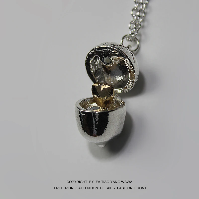 

Bored open small pine nuts to see inside the love! Pine nut necklace