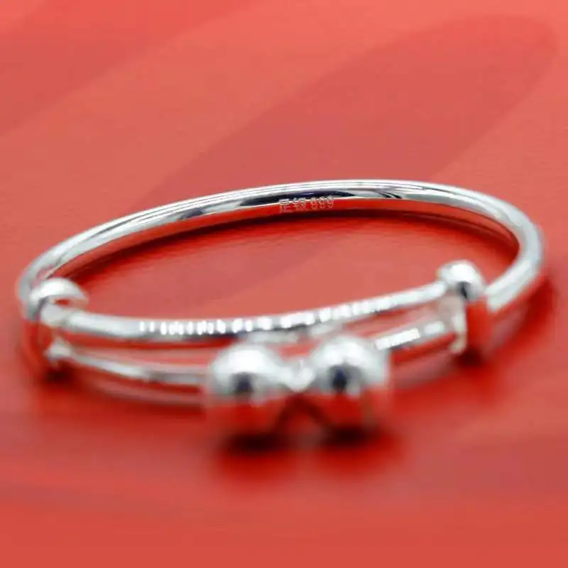 Браслет из серебра 9999 пробы с колокольчиком и надписью Благословение ребенка |