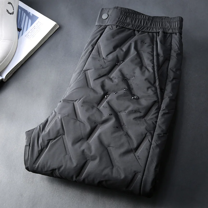 

Jsbd winter warm cow goods technology heating printing glue thickened warm men's slim casual down cotton pants