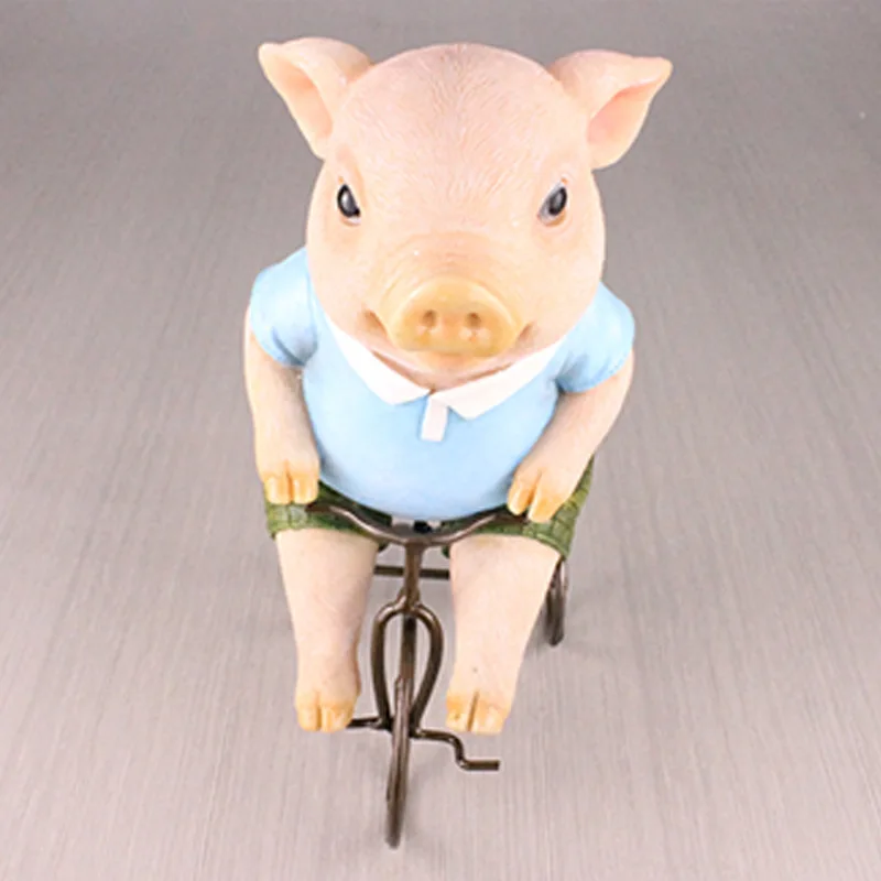 

Creative Resin Pig Brown Bear Riding a Bicycle Figurines Home Decoration Wedding Gifts Living Room Bedroom Animal Figures Decor